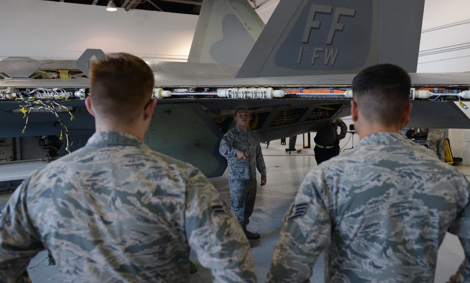 U.S. Air Force Staff Sgt. Daniel Rivera, 1st Maintenance Group maintenance training instructor, demonstrates the proper procedures for hot pit refueling for Airmen involved in each part of the process during a training class at Joint Base Langley-Eustis, Va., Sept. 13, 2016. The maintenance training section instructors teach approximately 190 courses each year to Airmen from the 1st MXG and the 192nd Maintenance Group. (U.S. Air Force photo by Staff Sgt. Teresa J. Cleveland)