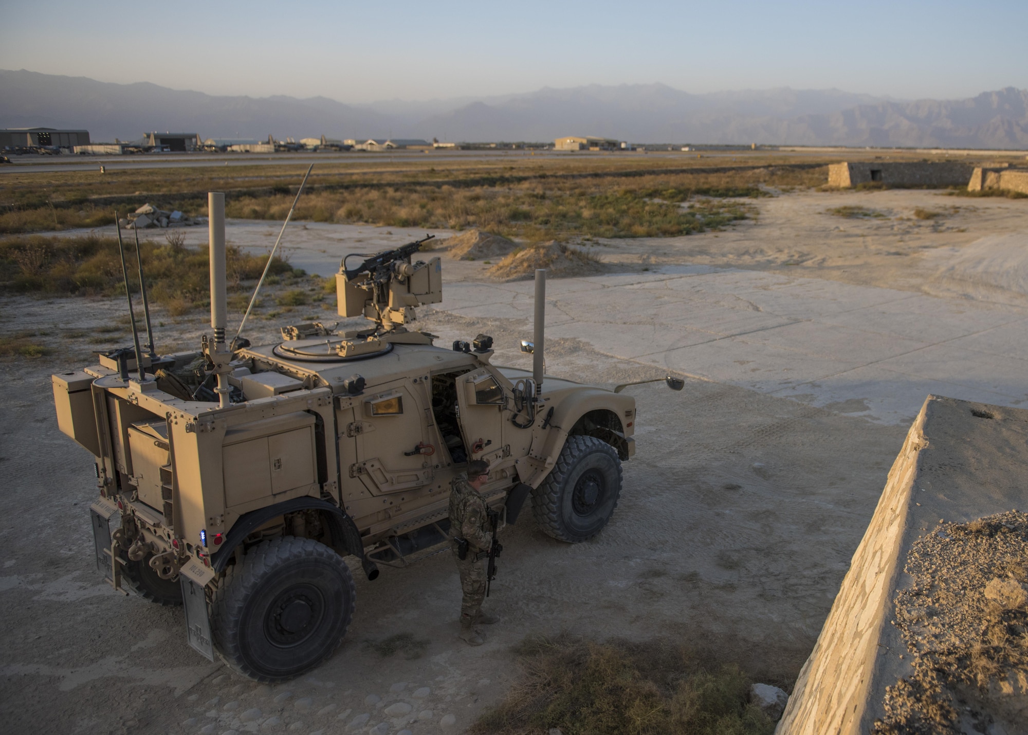 Senior Airman Michael Van Deusen, 455th Expeditionary Security Forces Squadron quick reaction force, gets out of a mine-resistant ambush-protected (MRAP) vehicle, Bagram Airfield, Afghanistan, Sept. 27, 2016. MRAPs are equipped with an independent suspension system to combat rocky terrain, mountainous off-rod environments, and dispersed combat operations. (U.S. Air Force photo by Senior Airman Justyn M. Freeman)