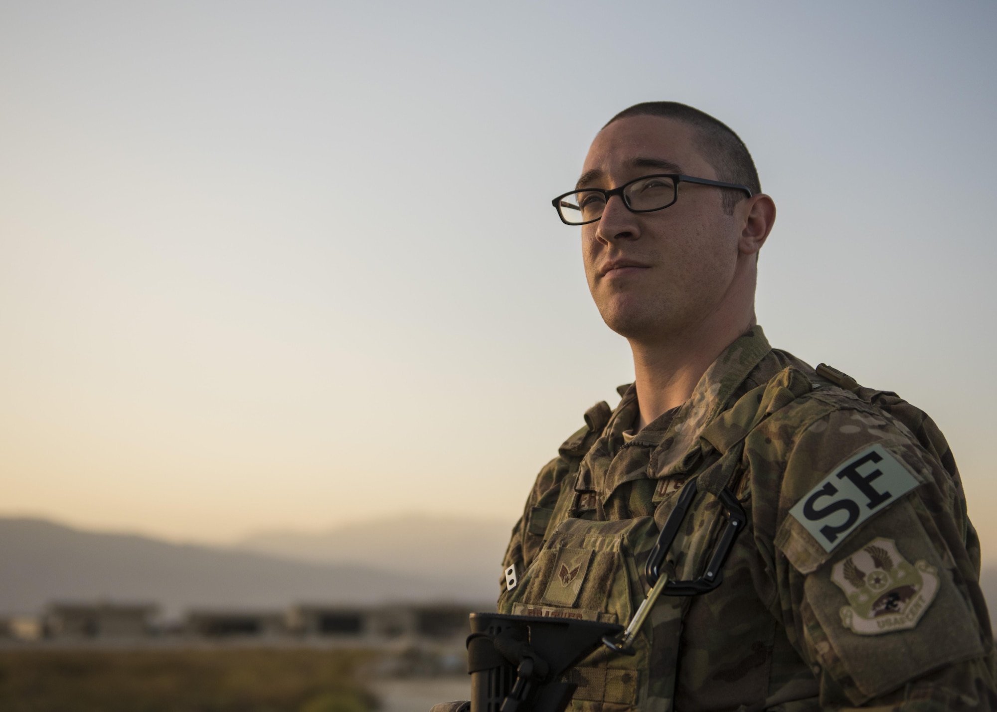 Senior Airman Jay Prather, 455th Expeditionary Security Forces Squadron quick reaction force, looks across the flightline during a patrol, Bagram Airfield, Afghanistan, Sept. 27, 2016. Members of the 455th ESFS QRF teams check buildings and other areas on the flightline in order to deter threats. (U.S. Air Force photo by Senior Airman Justyn M. Freeman)