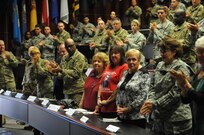 Soldiers from the 63rd Regional Support Command give standing applause to Gold Star Mothers (from left to right) Beverly Balsley, Dianne Layfield and Deloris Kesterson, in honor of their sacrifices during the 63rd RSC’s 4th annual Gold Star Family Day event, Sept. 24, Armed Forces Reserve Center, Mountain View, Calif. (U.S. Army Reserve photo by Capt. Alun Thomas)