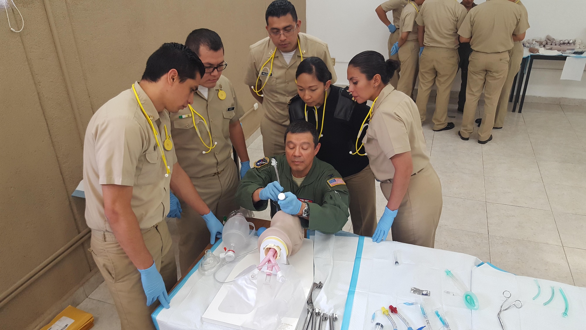 Col Antonio Delgado (pictured center), current Interim Director of AFMS International Health Specialist program, at an intubation station at CASEVAC training for Mexican Navy Medical Residents in Mexico City, Mexico. July 2016.