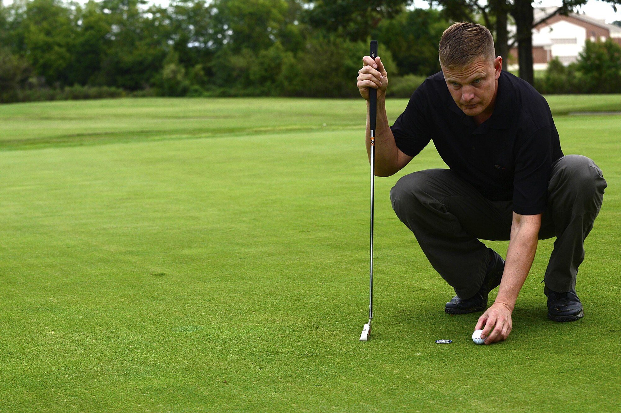 U.S. Air Force Lt. Col. Richard Atwell Jr., 633rd Comptroller Squadron commander, prepares to putt during the Fall 2016 Commander’s Cup at Joint Base Langley-Eustis, Va., Sept. 23, 2016. The tournament provided members of the JBLE and Hampton Roads community a chance to come together, in teams of four, to enjoy a day of friendly competition. (U.S. Air Force photo by Airman 1st Class Kaylee Dubois)
