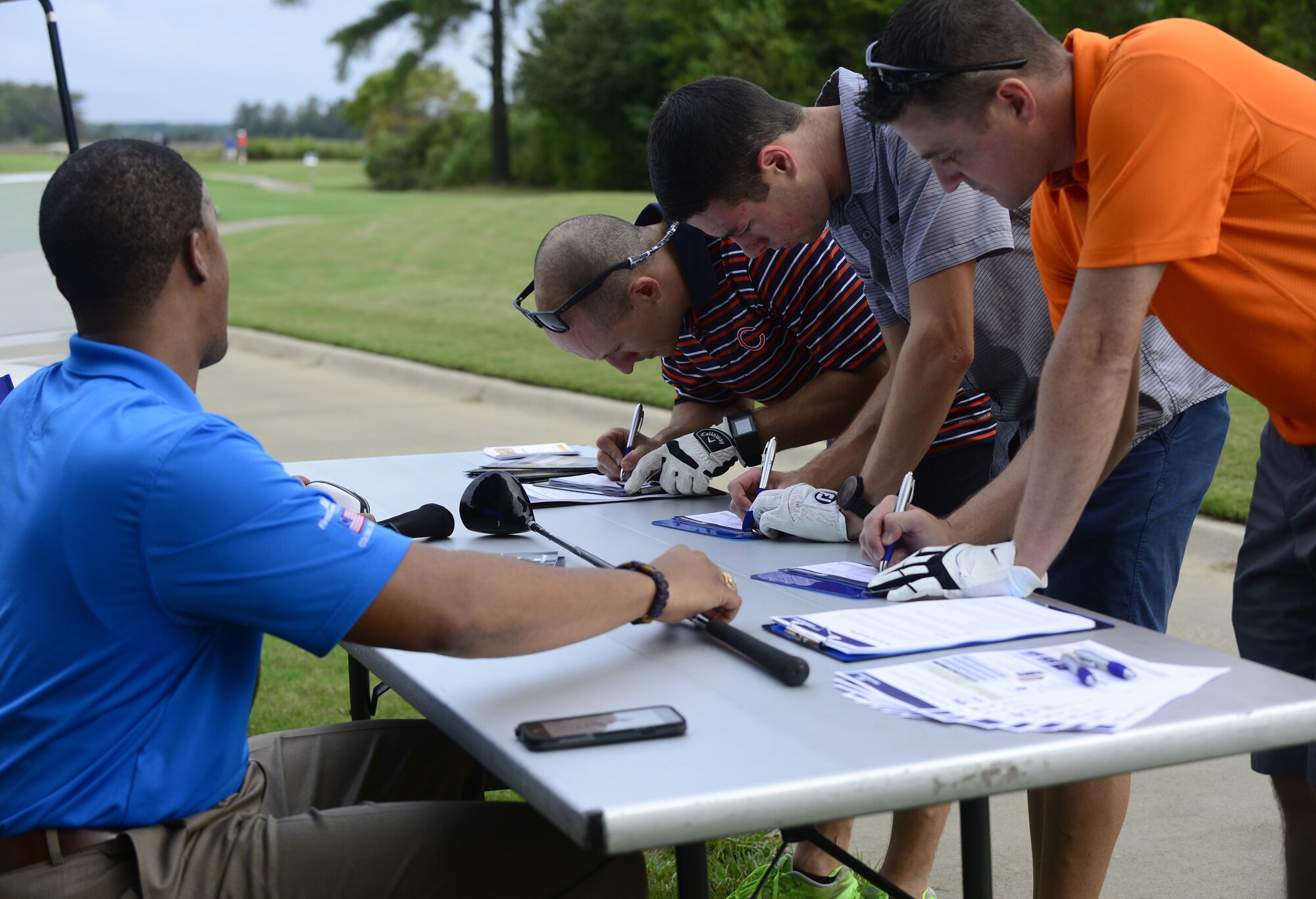 Participants in the Fall 2016 Commander’s Cup sign up for a raffle during the tournament at Joint Base Langley-Eustis, Va., Sept. 23, 2016. As a way to branch out into the community, sponsors provided participants giveaways and a chance to win prizes during the tournament. (U.S. Air Force photo by Airman 1st Class Kaylee Dubois)