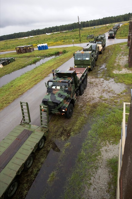 Vehicles are prepared for a convoy during a field exercise aboard Marine Corps Outlying Field Camp Davis, N.C., Sept. 22, 2016. Support squadrons across the Marine Corps conduct these exercises to remain ready for any challenge they may face in forward deployed environments. This exercise featured training that included auxiliary airfield construction, ground security and airfield damage repair. The squadron's capabilities contribute to 2nd Marine Aircraft Wing's role in the Marine Air Ground Task Force's mission accomplishment. Marines participating in the exercise are assigned to Marine Wing Support Squadron 274, Marine Aircraft Group 29, 2nd MAW. (U.S. Marine Corps photo by Sgt. N.W. Huertas/Released) 