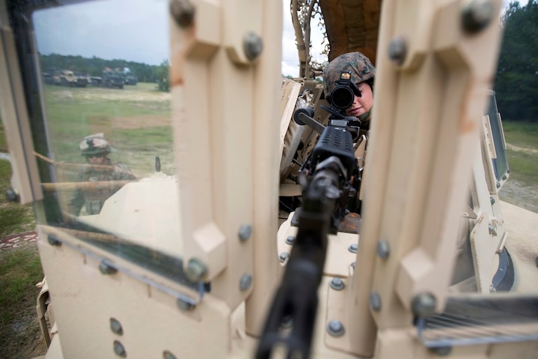 Cpl. Kassandra Cox-Ortega provides security during a field exercise aboard Marine Corps Outlying Field Camp Davis, N.C., Sept. 22, 2016. Support squadrons across the Marine Corps conduct these exercises to remain ready for any challenge they may face in forward deployed environments. This exercise featured training that included auxiliary airfield construction, ground security and airfield damage repair. The squadron's capabilities contribute to 2nd Marine Aircraft Wing's role in the Marine Air Ground Task Force's mission accomplishment. Cox-Ortega is a logistics and embarkation specialist assigned to Marine Wing Support Squadron 274, Marine Aircraft Group 29, 2nd MAW. (U.S. Marine Corps photo by Sgt. N.W. Huertas/Released) 