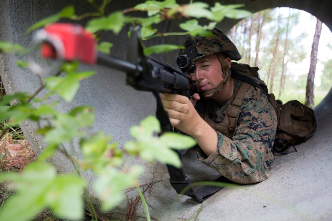 Lance Cpl. Bryan Naylor provides security during a field exercise aboard Marine Corps Outlying Field Camp Davis, N.C., Sept. 22, 2016. Support squadrons across the Marine Corps conduct these exercises to remain ready for any challenge they may face in forward deployed environments. This exercise featured training that included auxiliary airfield construction, ground security and airfield damage repair. The squadron's capabilities contribute to 2nd Marine Aircraft Wing's role in the Marine Air Ground Task Force's mission accomplishment. Naylor is a tactical switching operator assigned to Marine Wing Support Squadron 274, Marine Aircraft Group 29, 2nd MAW. (U.S. Marine Corps photo by Sgt. N.W. Huertas/Released) 