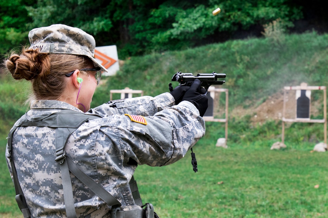 Army Spc. Stephanie Kultzow fires a 9 mm Berretta to qualify on the weapon at Camp Smith, N.Y., Sept. 20, 2016. Kultzow is a combat medic assigned to the New York Army National Guard’s 107th Military Police Company. Army National Guard photo by Sgt. Michael Davis