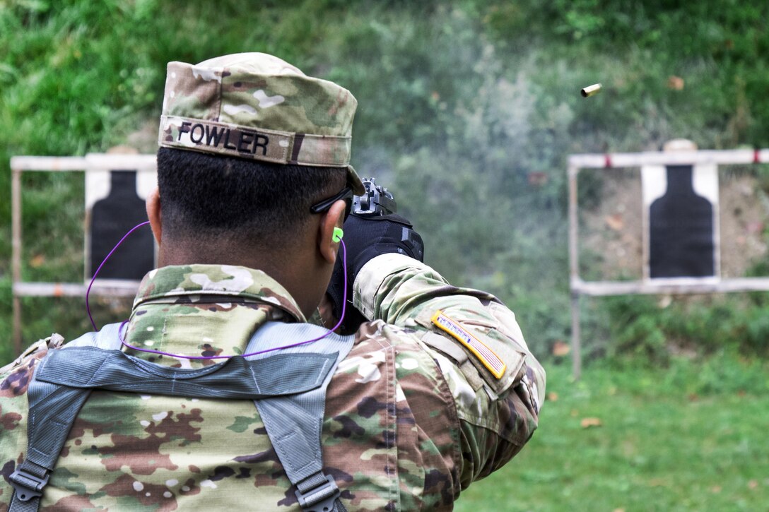 Army Spc. Justin Fowler fires his 9 mm Berretta on a range at Camp Smith, N.Y., Sept. 20, 2016. Fowler is a military police officer assigned to the New York Army National Guard’s 727th Military Police Detachment. Army National Guard photo by Sgt. Michael Davis