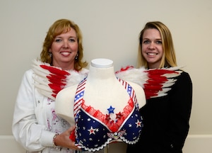 Wendy Elvis and Jamie Radik, 633rd Medical Group  mammography technologists, show off the bra they decorated for the Fill the Bra Campaign at Joint Base Langley-Eustis, Va., Sept. 21, 2016. The campaign, held in October for Breast Cancer Awareness Month, helps raise funds to provide healthcare to those uninsured and underinsured. (U.S. Air Force photo by Airman 1st Class Kaylee Dubois)