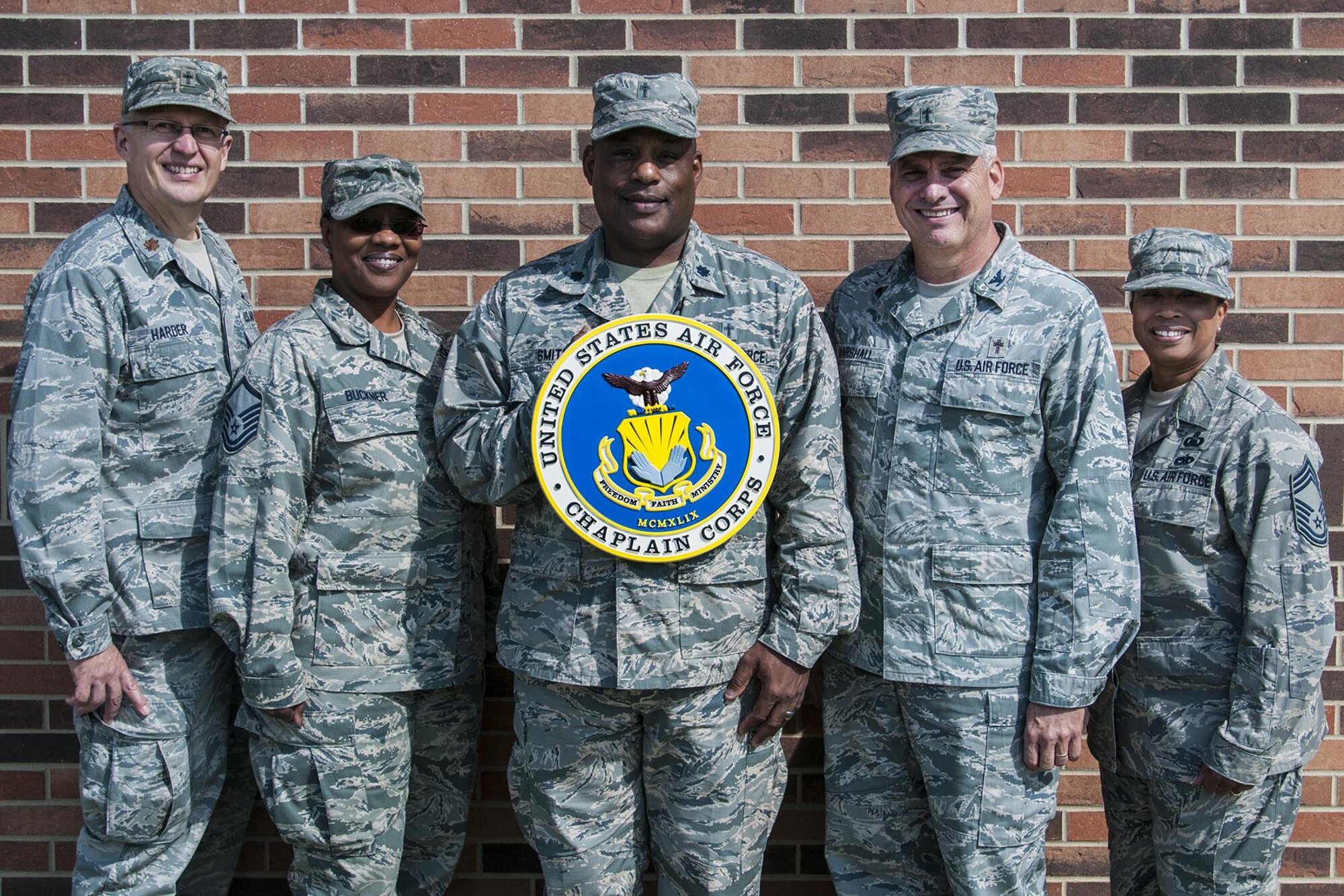 Chaplain (Maj.) Todd Harder, Master Sgt. Benita Buckner and Chaplain Lt. (Col.) Obadiah Smith, 434th Air Refueling Wing chaplain corps, pose with Chaplain (Col.) Randy Marshall and Chief Master Sgt. Chiquita Wilson, Air Force Reserve Command chaplain corps, at Grissom Air Reserve Base, Ind. Sept. 11, 2016. Marshall, deputy command chaplain, was visiting Grissom as part of a program designed to give the chaplain corps leadership a personal look at individual bases and units. (U.S. Air Force photo/Staff Sgt. Dakota Bergl)