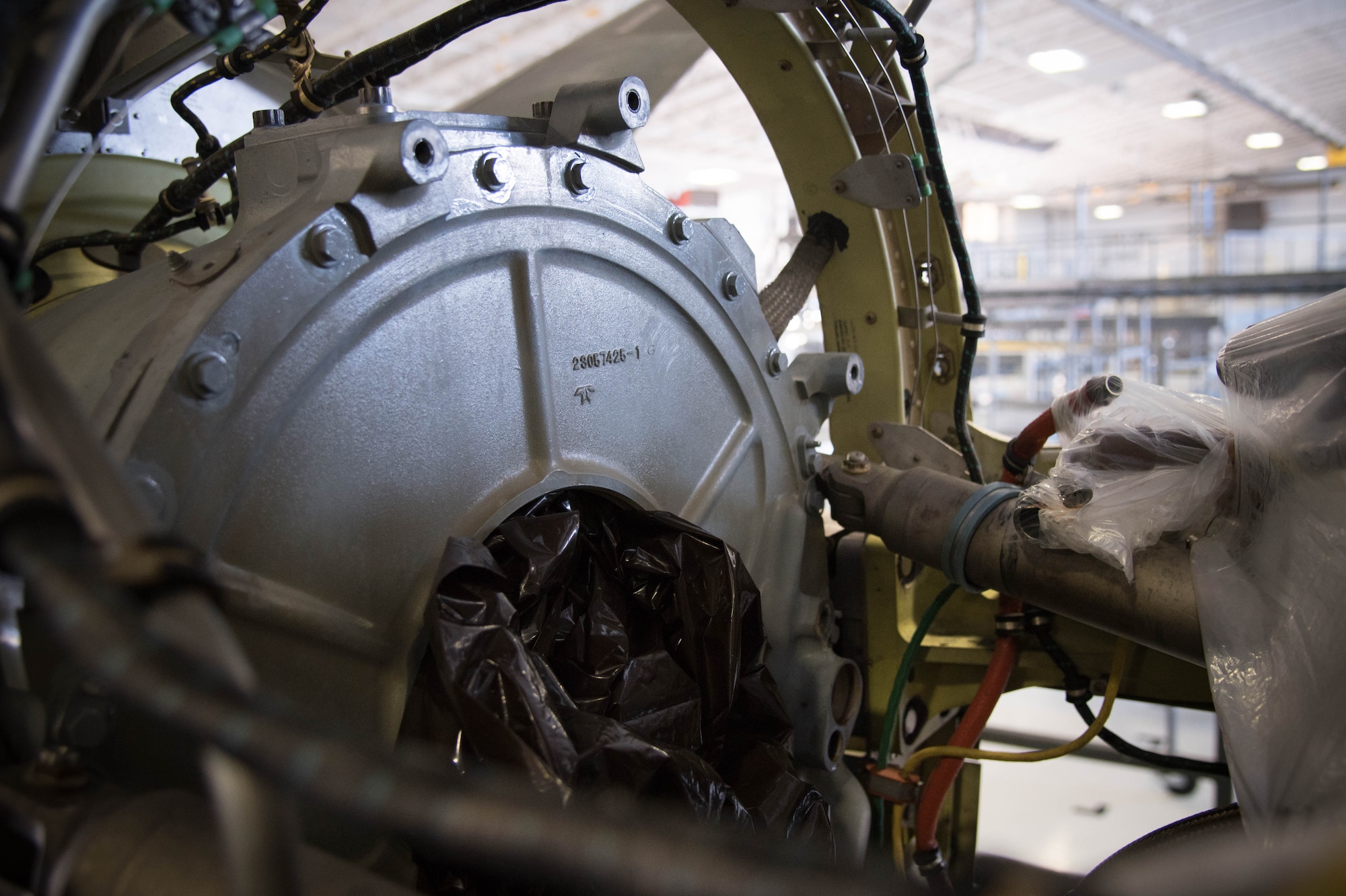 A C-130J engine sits in the isochronal inspection hangar without a gear mounted accessory drive, which was removed for the installation of a new propeller brake. Rolls Royce employees are traveling from base to base working with Airmen for a fleet-wide upgrade of engines in every C-130J aircraft.(U.S. Air Force photo/Senior Airman Heather Heiney)