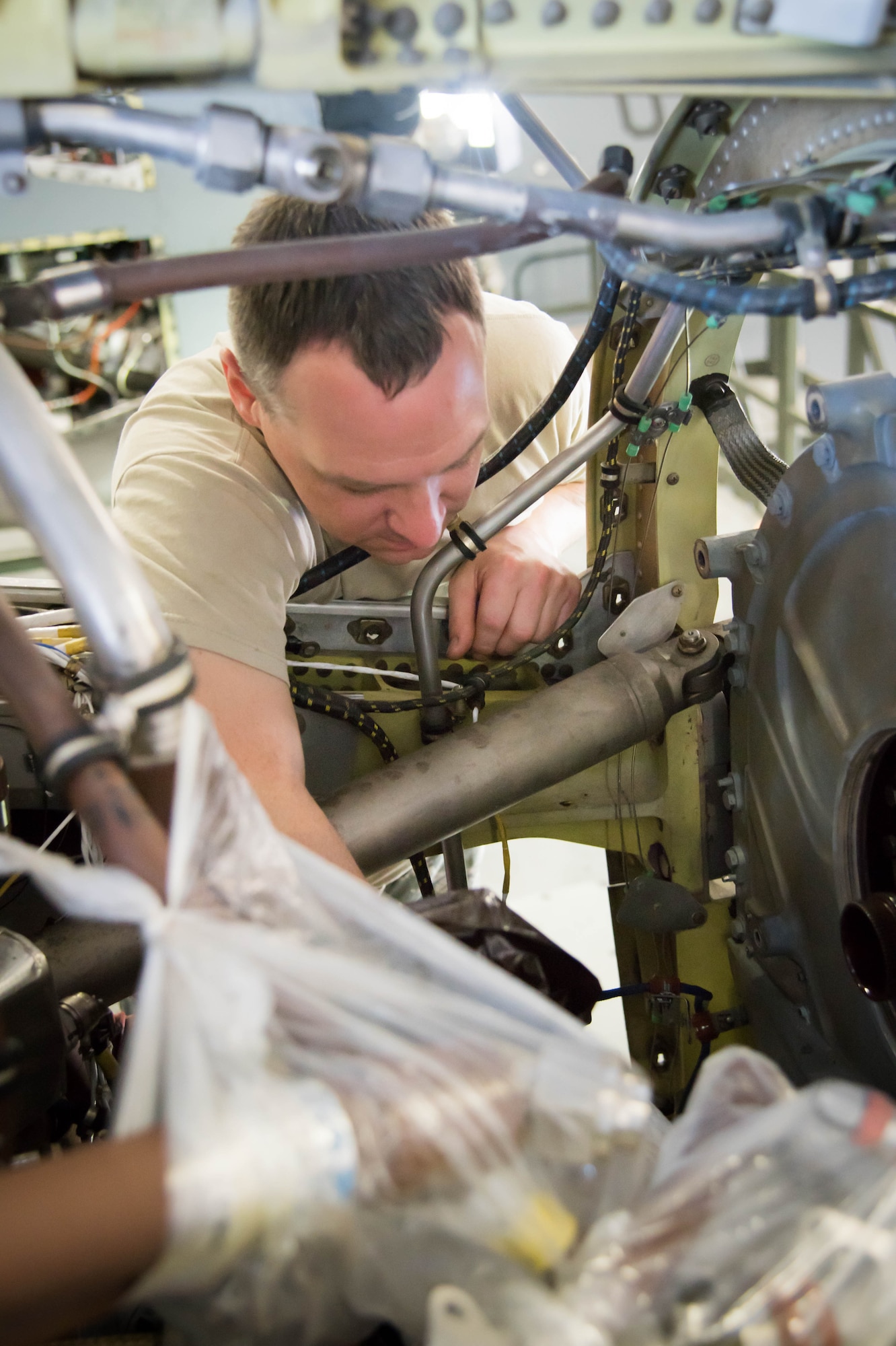 Tech Sgt. Joseph Griffin, 403rd Maintenance Squadron aerospace propulsion craftsman, inspects a C130J engine after its gear mounted accessory drive was removed for the installation of a propeller break. Rolls Royce employees are traveling from base to base working with Airmen for a fleet-wide upgrade of engines in every C-130J aircraft.(U.S. Air Force photo/Senior Airman Heather Heiney)