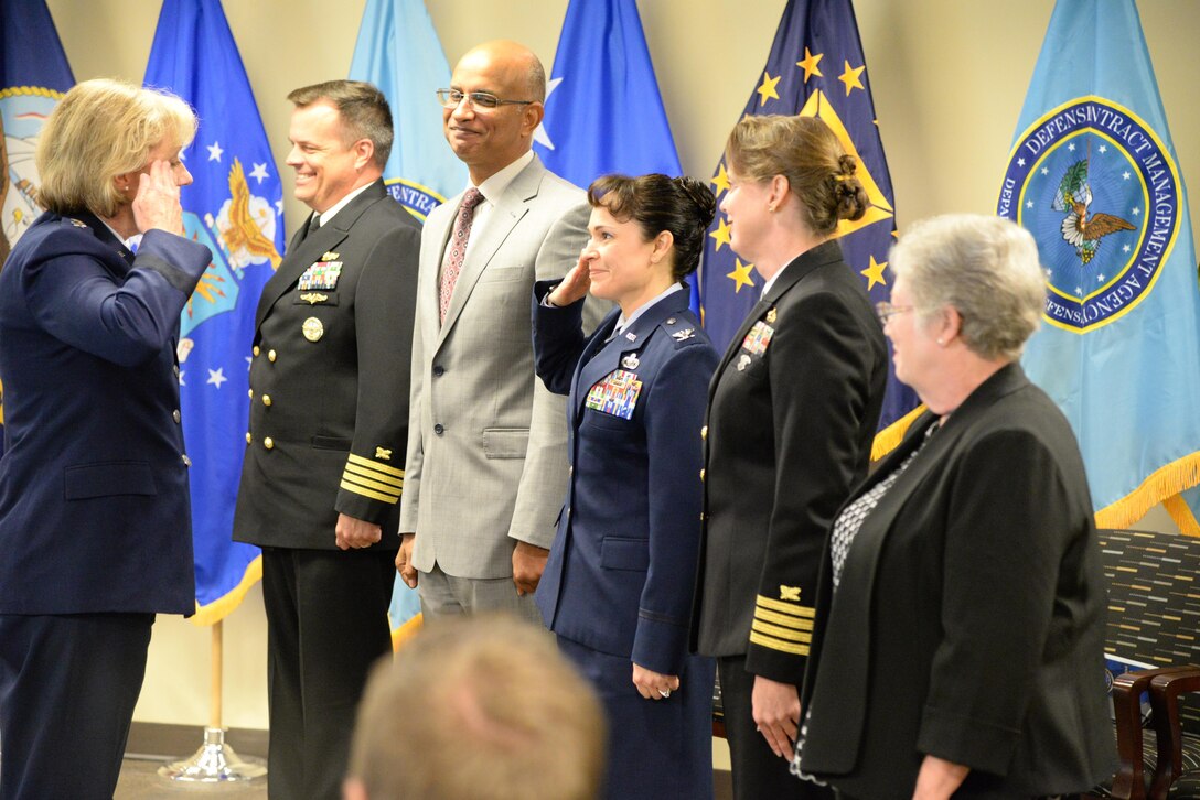Air Force Lt. Gen. Wendy Masiello, Defense Contract Management Agency director, salutes the agency's regional commanders signaling the start of their new roles as operational unit leaders for their regions. The group assembled for a Sept. 22 ceremony at Fort Lee, Virginia, to mark the disestablishment of the agency's Operations Directorate. 