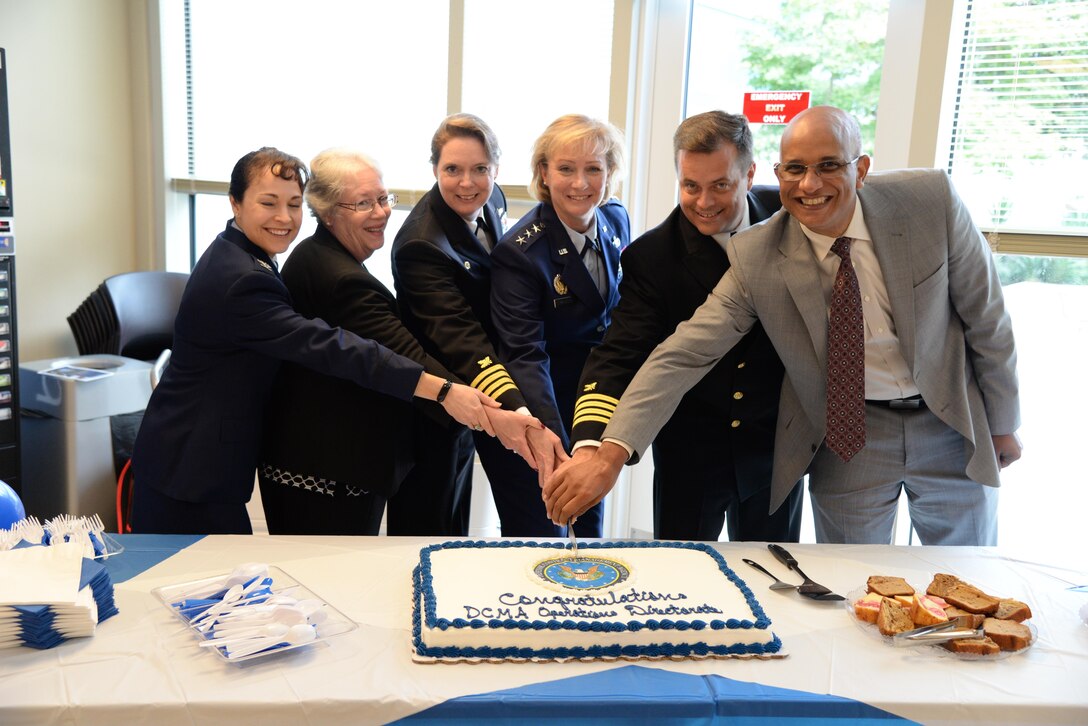 Defense Contract Management Agency Director Air Force Lt. Gen. Wendy Masiello and commanders of the agency's Eastern, Central, Western and International Regions, as well as the Special Programs Directorate, slice a cake following a Sept. 22 ceremony at Fort Lee, Virginia. 