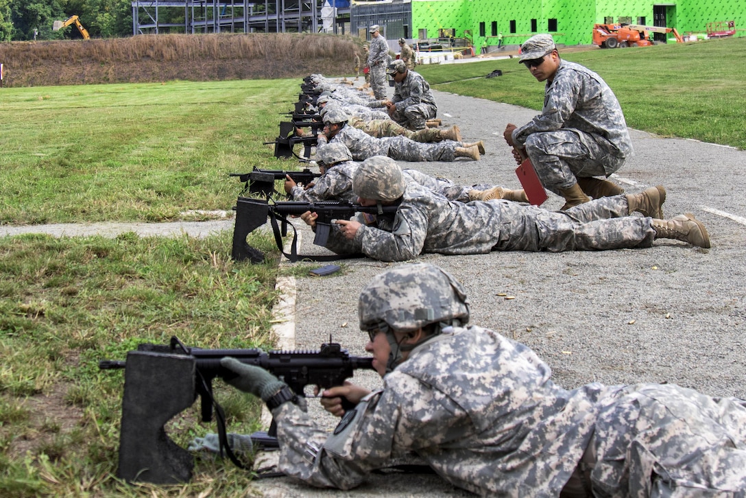 Army range safety officers observe as soldiers fire M4A1 carbines at Camp Smith, N.Y., Sept. 20, 2016. Army National Guard photo by Sgt. Michael Davis