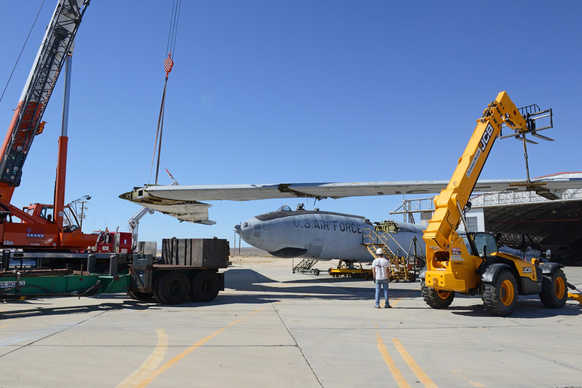 Workers move the wing of the XB-47 slowly into place to attach it to the fuselage Sept. 26. (U.S. Air Force photo by Kenji Thuloweit)
