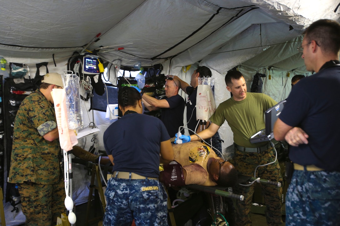 Corpsmen perform an ultrasound on a notional casualty during a training evolution on Camp Lejeune, N.C., Sept. 22, 2016. The Navy Medical Augmentation Program Sustainment Training brings corpsmen from up and down the east coast to Camp Lejeune to get hands-on training. The corpsmen are attached to the 2nd Medical Battalion but are assigned at different stations throughout the east coast. (U.S. Marine Corps photo by Lance Cpl. Jon Sosner)