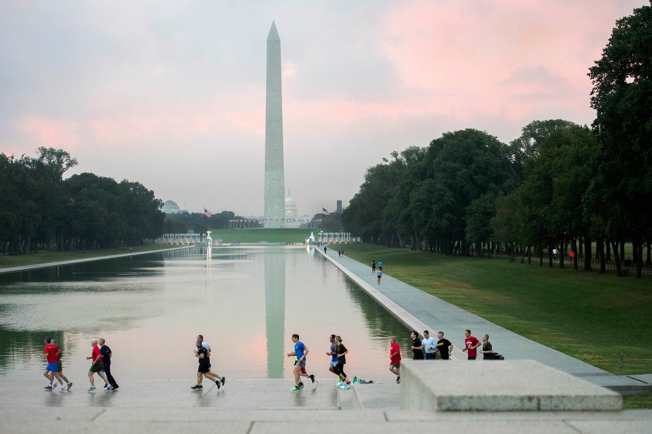 Crown Prince Frederik of Denmark, front left, runs with wounded service members, wounded veterans and military families along the Lincoln Memorial Reflecting Pool in Washington, D.C., Sept. 28, 2016. Frederik and the U.S. and Danish veterans completed 3.8 miles around the National Mall. DoD photo by EJ Hersom