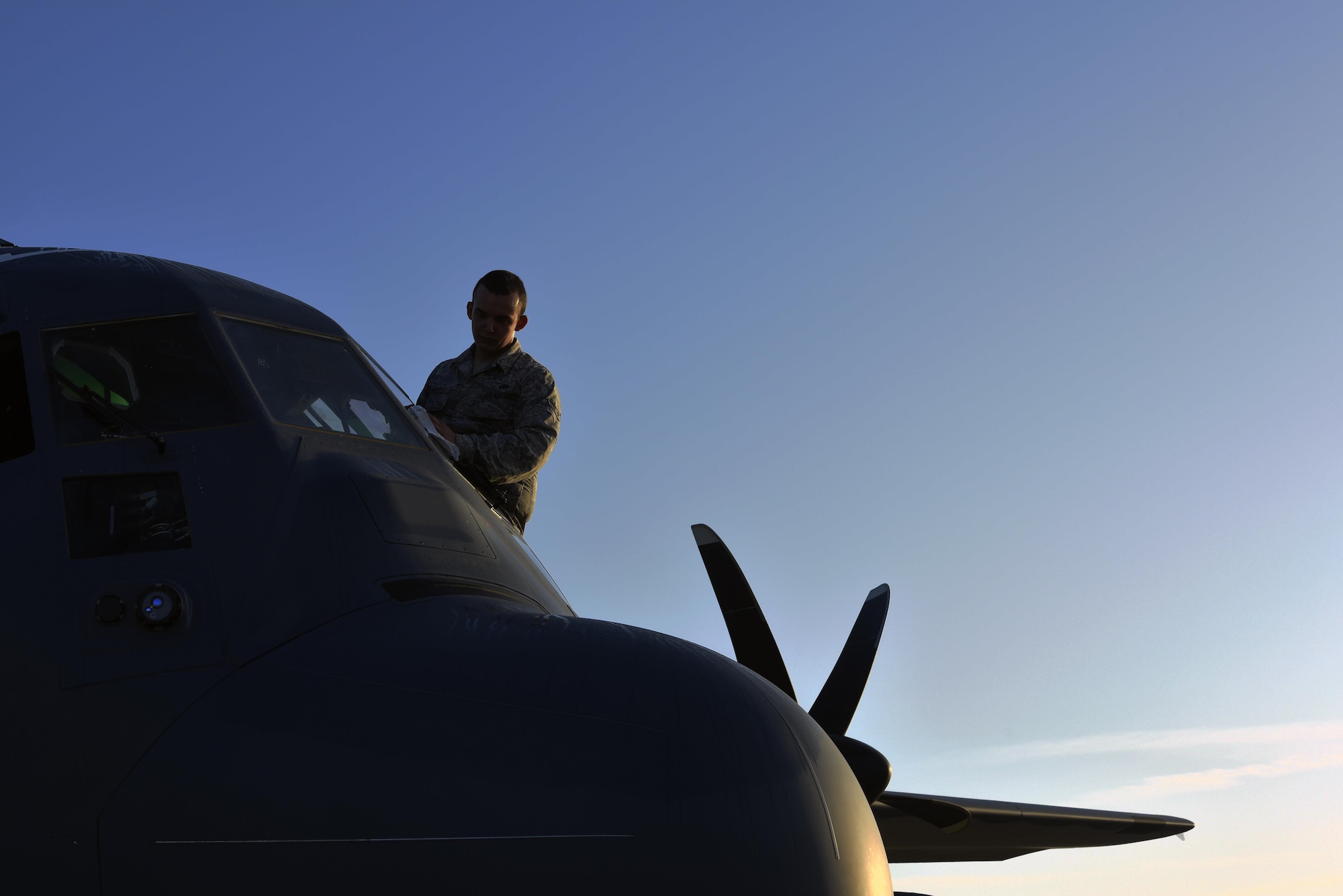 U.S. Air Force Airman 1st Class Justin Roberts, 71st Rescue Squadron crew chief, cleans the windshield of an HC-130J Combat King II prior to pilot proficiency training, Sept. 27, 2016, at Moody Air Force Base, Ga. During training, pilots test the HC-130J’s capabilities to perform a multitude of flying techniques that aid search and rescue efforts, air refueling and airdrop operations. (U.S. Air Force photo by Airman 1st Class Greg Nash)