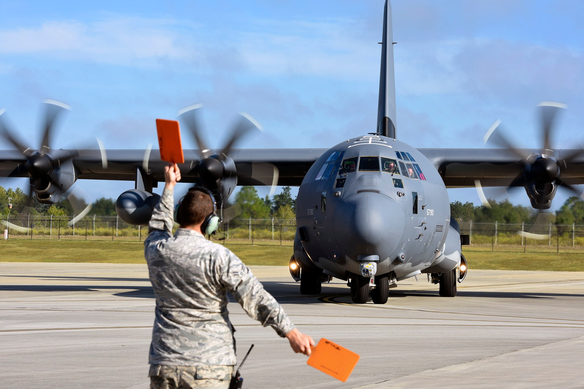 U.S. Air Force Airman 1st Class Justin Roberts, 71st Rescue Squadron crew chief, marshals an HC-130J Combat King II before take-off, Sept. 27, 2016, at Moody Air Force Base, Ga. Members of the 71st RQS are responsible for maintaining combat-ready HC-130J aircraft to provide rapidly deployable, expeditionary personnel recovery forces for contingency and crisis response operations worldwide. (U.S. Air Force photo by Airman 1st Class Greg Nash)