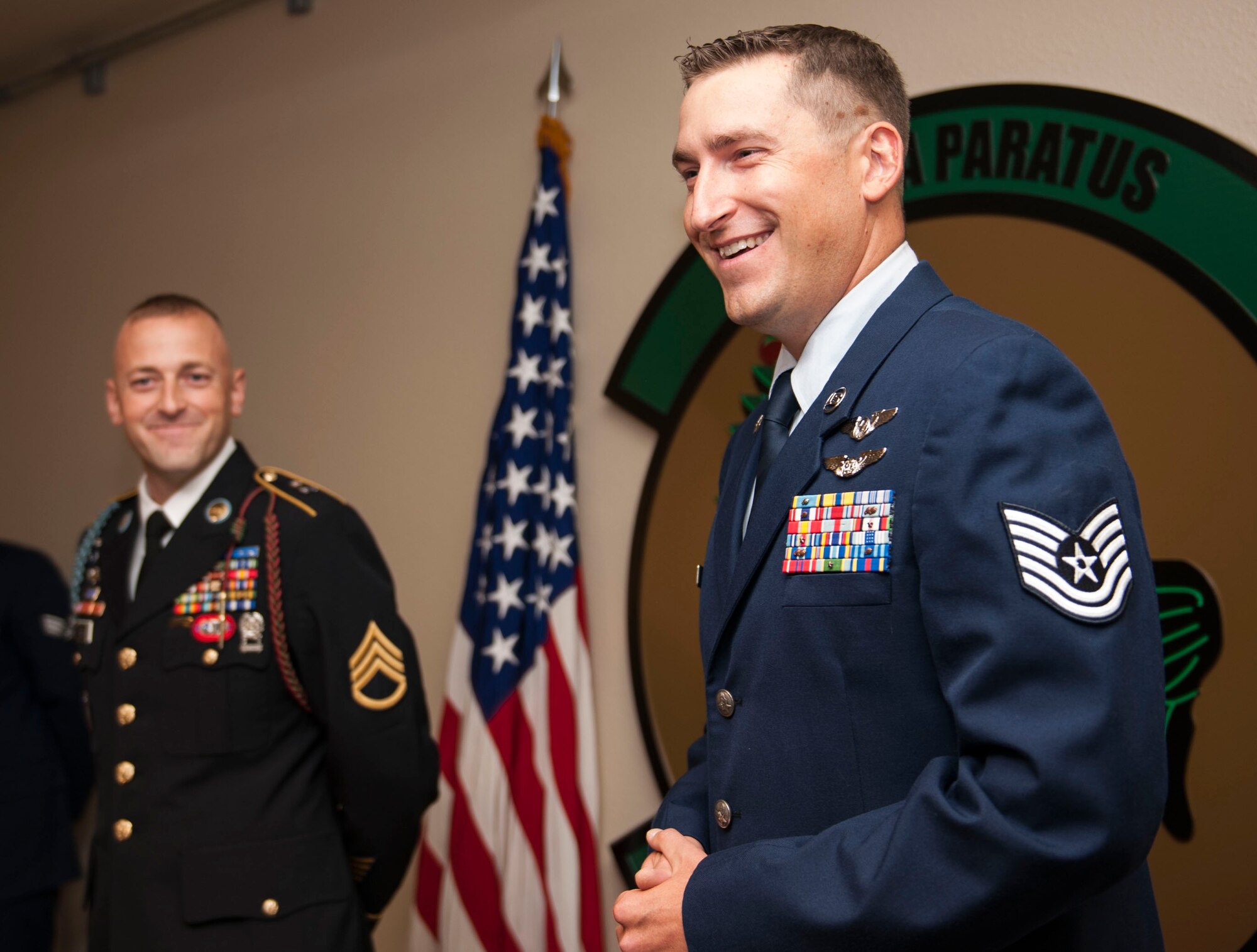 U.S. Air Force Tech. Sgt. Michael Elsik, laughs as he speaks at his and his brother’s joint promotion Sept. 9, 2016, at Cannon Air Force Base, N.M. Elsik and his brother, U.S. Army Staff Sgt. Flint Elsik were promoted to the grade of E-6 together. (U.S. Air Force photo by Staff Sgt. Eboni Reams/Released)