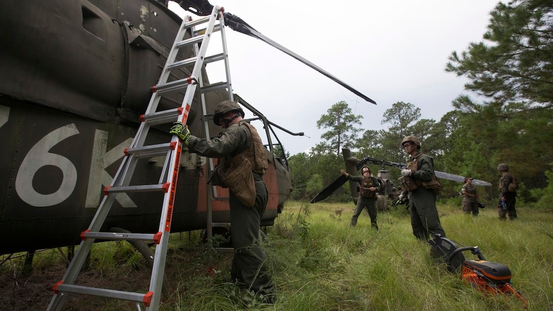 Marines rehearse salvaging an aircraft during a field exercise at Marine Corps Outlying Field Camp Davis, N.C., Sept. 22, 2016. Support squadrons across the Marine Corps conduct these exercises to remain ready for any challenge they may face in forward deployed environments. This exercise featured training that included auxiliary airfield construction, ground security and airfield damage repair. The squadron's capabilities contribute to 2nd Marine Aircraft Wing's role in the Marine Air Ground Task Force's mission accomplishment. The Marines participating in the exercise are assigned to Marine Wing Support Squadron 274, Marine Aircraft Group 29, 2nd MAW. 