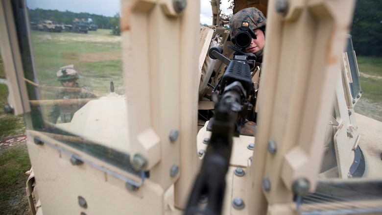 Cpl. Kassandra Cox-Ortega provides security during a field exercise aboard Marine Corps Outlying Field Camp Davis, N.C., Sept. 22, 2016. Support squadrons across the Marine Corps conduct these exercises to remain ready for any challenge they may face in forward deployed environments. This exercise featured training that included auxiliary airfield construction, ground security and airfield damage repair. The squadron's capabilities contribute to 2nd Marine Aircraft Wing's role in the Marine Air Ground Task Force's mission accomplishment. Cox-Ortega is a logistics and embarkation specialist assigned to Marine Wing Support Squadron 274, Marine Aircraft Group 29, 2nd MAW. 