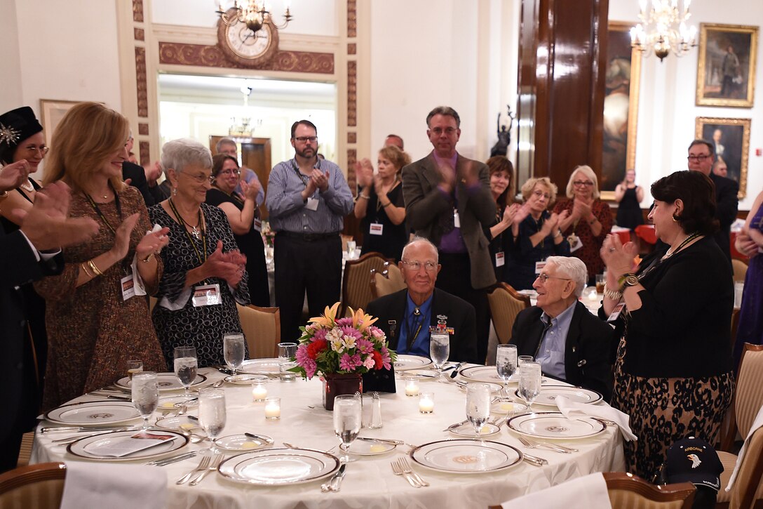Guests attending the 70th anniversary of Easy Company, 2nd Battalion, 506th Parachute Infantry Regiment, 101st Airborne Division reunion applaud for World War II veterans Brad Freeman, sitting left, and Albert Mampre. Both men were members of Easy Company and the only two members at the reunion in Chicago, September 24, 2016.
(U.S. Army photo by Sgt. Aaron Berogan/Released)