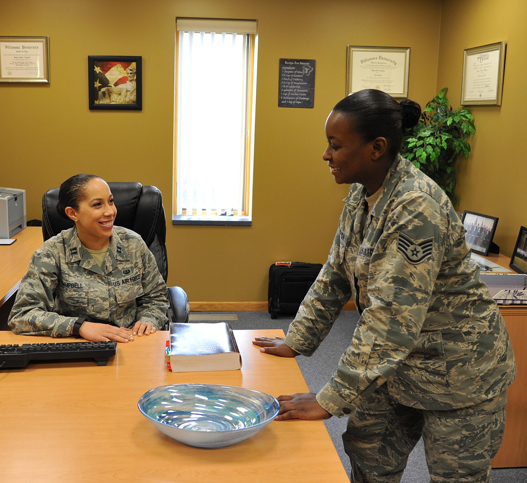 Area Defense Counsel Capt. M. Dedra Campbell and Defense Paralegal Staff Sgt. Natesha Champion represent the Area Defense Counsel on Grand Forks Air Force Base, N.D. Sept. 28. The ADC operates under a separate chain of command which allows the ADC to provide confidential legal advice without command influence. (U.S. Air Force photo by Airman 1st Class Elijaih Tiggs)