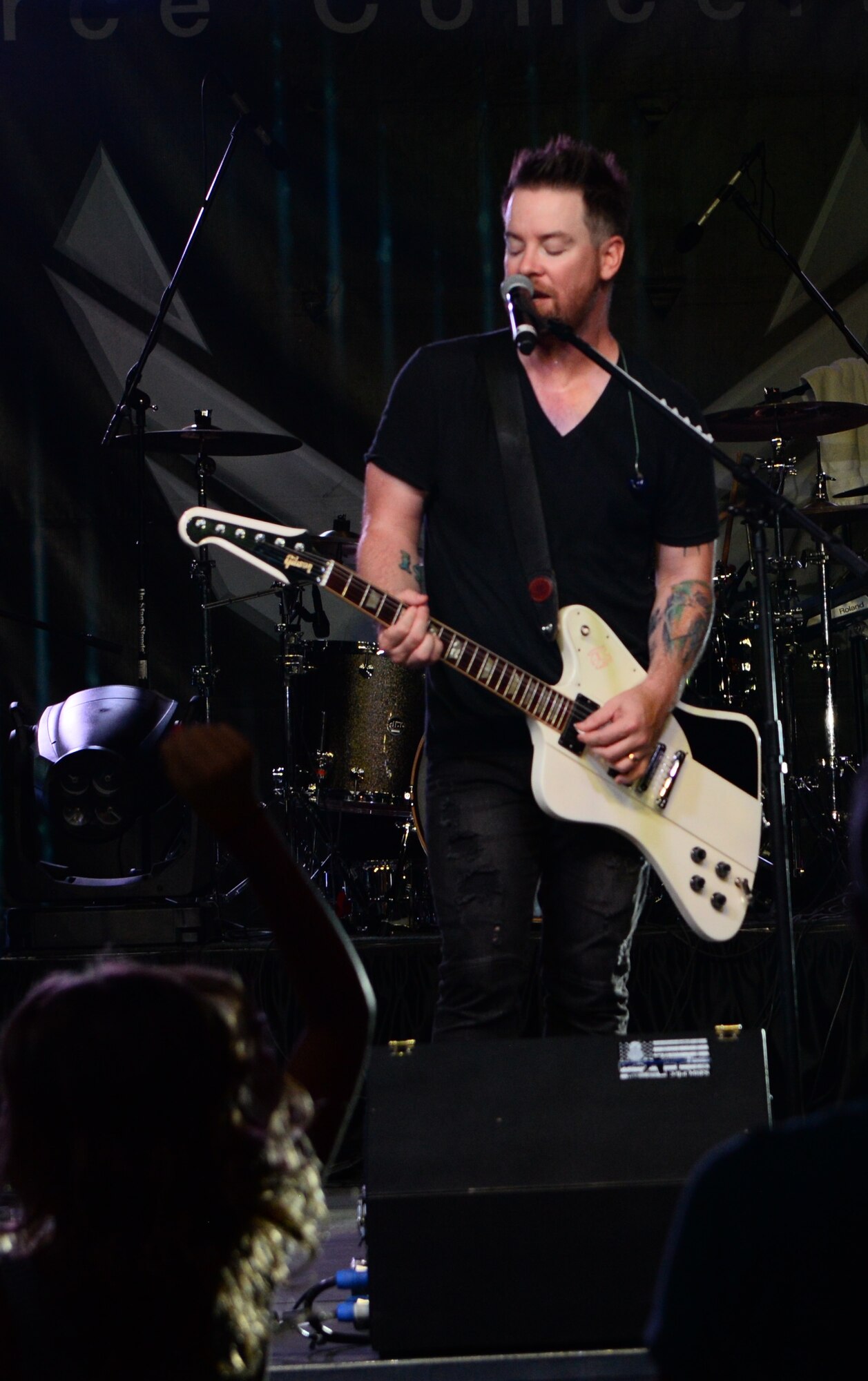 David Cook, American Idol season seven winner, perform Sept. 25 at Columbus Air Force Base, Mississippi. The evening began at 4 p.m. with a pool party at Independence Pool where guests were able to swim, play on bouncy castles, and enjoy hamburgers until 7 p.m. when Cook took to the stage. (U.S. Air Force photo by 1st Lt. Lauren Woods)