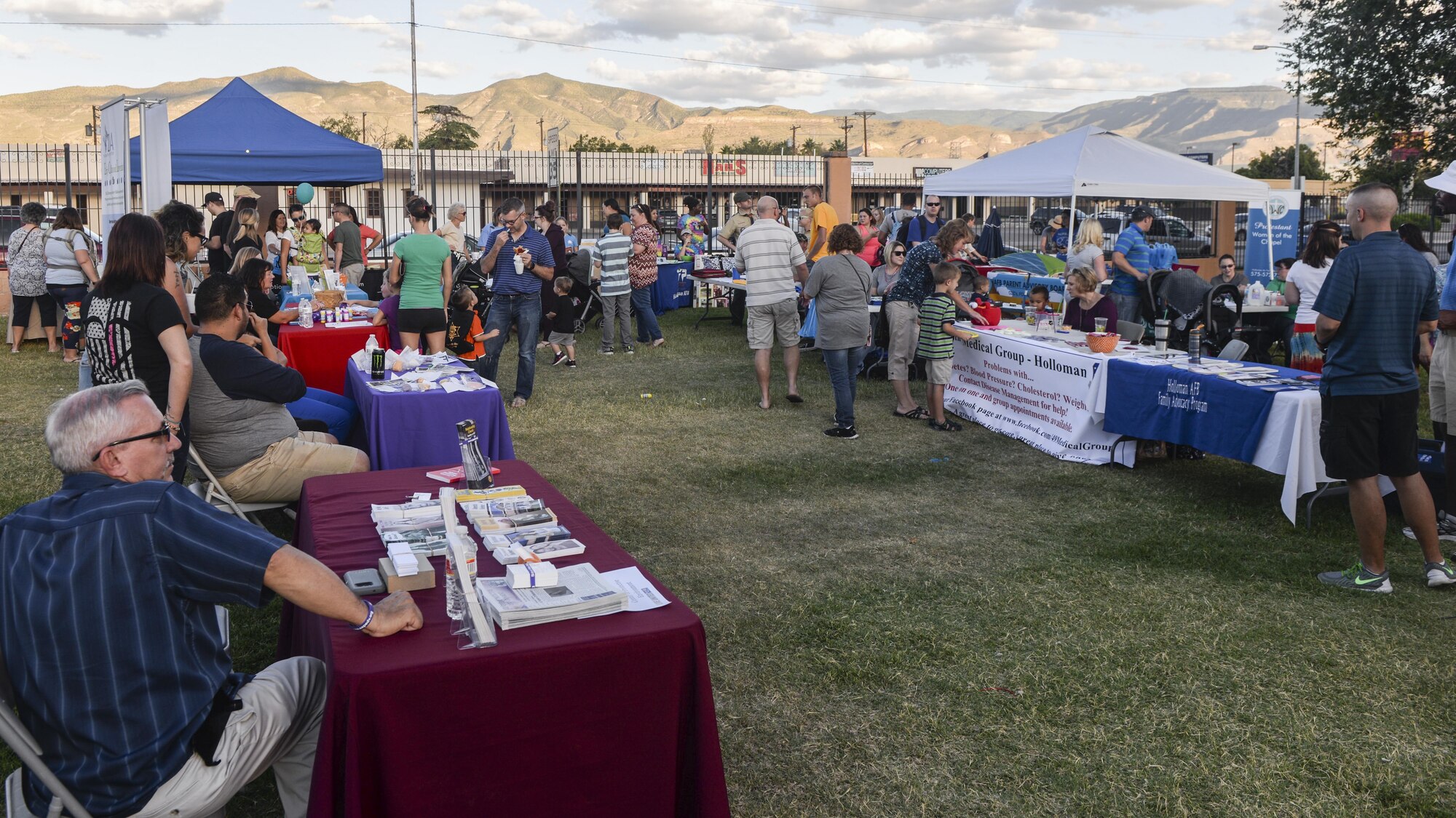 Members from various agencies and non-profit organizations talk to guests at the annual Zoo After Hours event at Alameda Park Zoo in Alamogordo, N.M. on Sept. 24, 2016. The event was open to all active duty military personnel and their families. (U.S. Air Force photo by Airman 1st Class Alexis P. Docherty) 