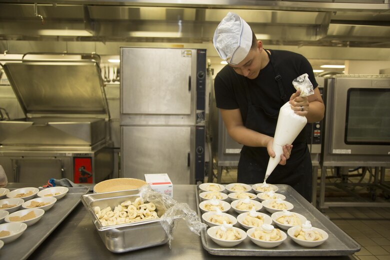 Lance Cpl. Kenneth Martin, food service specialist, Headquarters Battalion, prepares banana cream pie as his dessert dish during the Chef of the Quarter competition at Phelps Mess Hall aboard Marine Corps Air Ground Combat Center, Twentynine Palms, Calif., Sept. 21, 2016. The competition is held every quarter and provides Marine and civilian chefs aboard the installation an opportunity to showcase their cooking expertise. (Official Marine Corps photo by Lance Cpl. Eric Clayton/Released)
