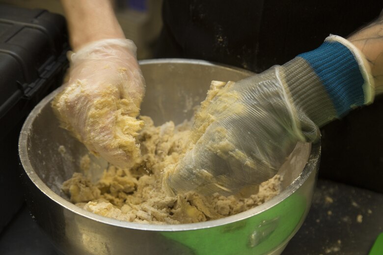 A civilian food service specialist with Sodexo prepares a dish during the Chef of the Quarter competition at Phelps Mess Hall aboard Marine Corps Air Ground Combat Center, Twentynine Palms, Calif., Sept. 21, 2016. The competition is held every quarter and provides Marine and civilian chefs aboard the installation an opportunity to showcase their cooking expertise. (Official Marine Corps photo by Lance Cpl. Eric Clayton/Released)