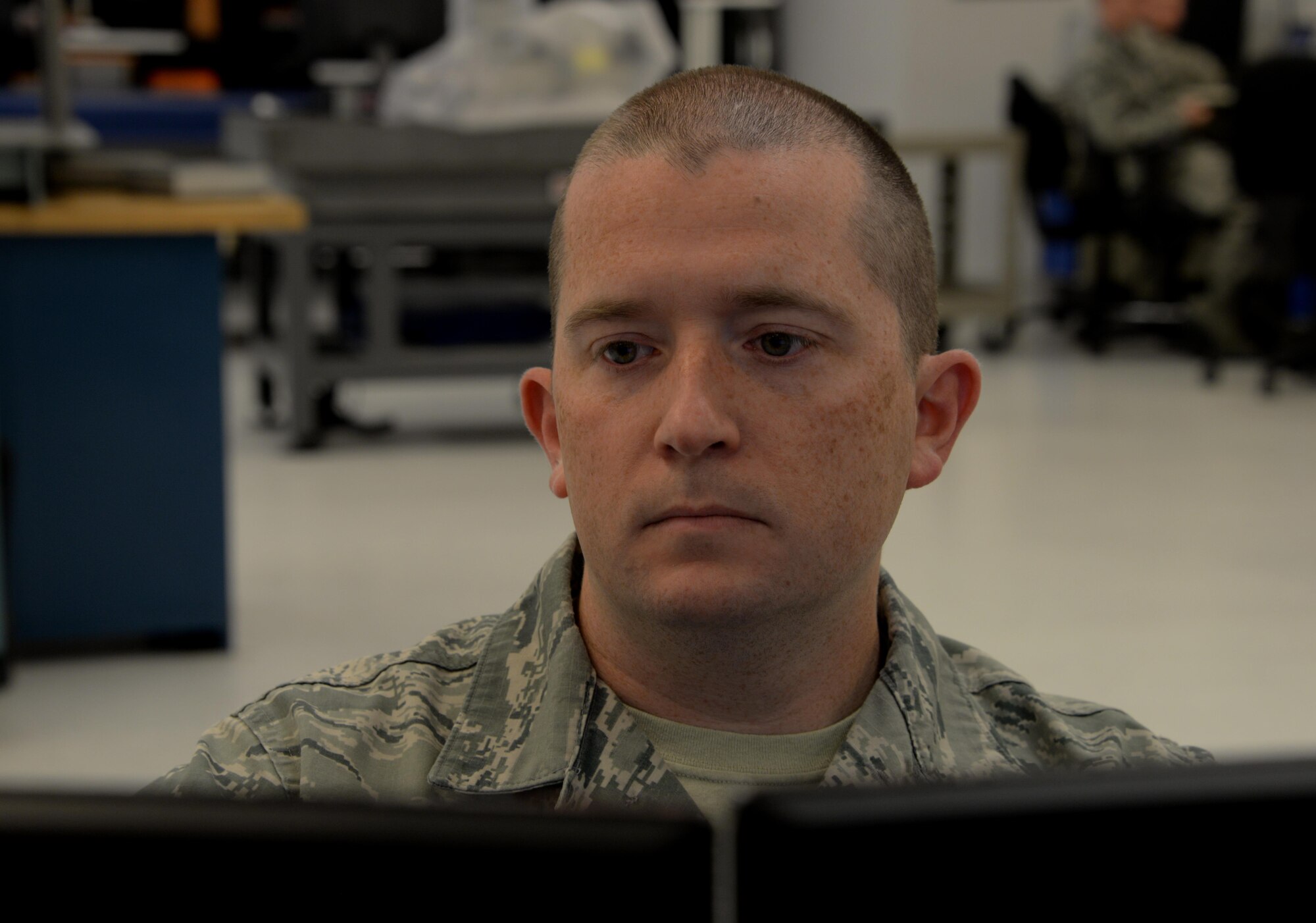 Staff Sgt. Timothy Gould, 60th Maintenance Squadron precision measurement equipment laboratory technician from Buffalo, New York, reviews a report on his computer at Travis Air Force Base, Calif., Sept. 27, 2016. The Travis PMEL team conducts about 12,000 calibrations a year and supports units at 15 bases. (U.S. Air Force photo/Tech. Sgt. James Hodgman)