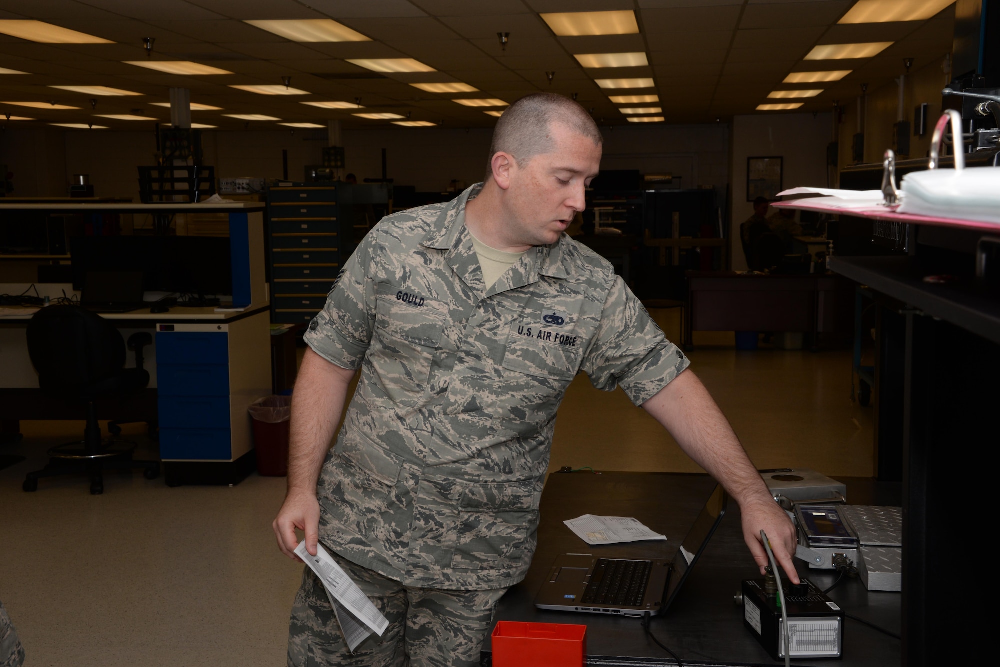 Staff Sgt. Timothy Gould, 60th Maintenance Squadron precision measurement equipment laboratory technician from Buffalo, New York, conducts a check of equipment inside the PMEL at Travis Air Force Base, Calif., Sept. 27, 2016. The Travis PMEL team conducts about 12,000 calibrations a year and supports units at 15 bases. (U.S. Air Force photo/Tech. Sgt. James Hodgman)