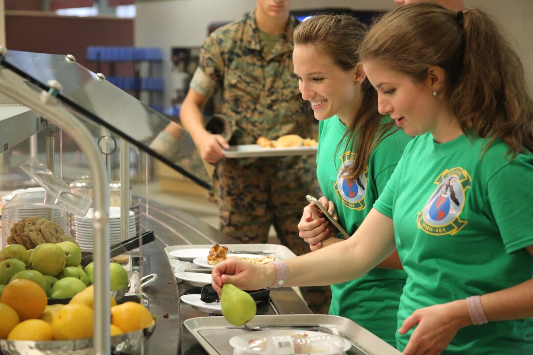 Spouses of Marines with Marine Aircraft Group 29 dine at the mess hall during “Marine for a Day,” an event hosted at Marine Corps Air Station New River, N.C., Sept. 23, 2016. The purpose of the event was to give spouses a better perspective of the mental and physical demands their Marines go through on a day-to-day basis in order to maintain their personal readiness. The event included hands-on practice at the Indoor Simulated Marksmanship Trainer, a tour of the various aircraft aboard the air station, Marine Corps Martial Arts Program familiarization, a combat fitness test and more. (U.S. Marine Corps photo by Lance Cpl. Mackenzie Gibson/Released)