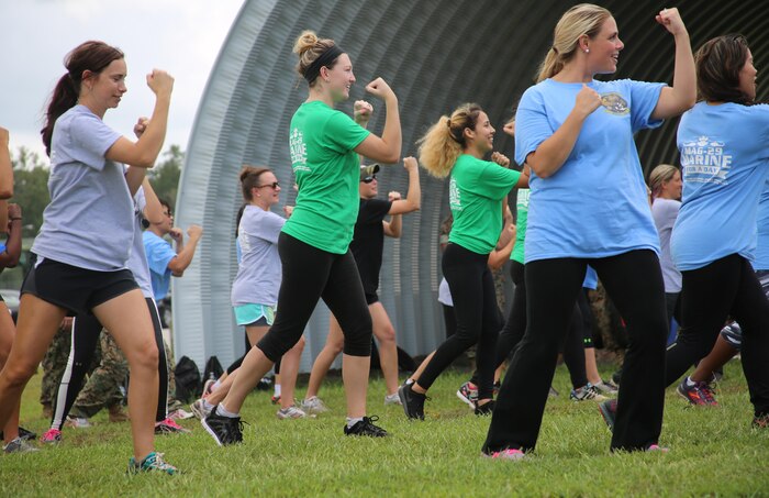 Spouses of Marines with Marine Aircraft Group 29 execute basic Marine Corps Martial Arts during “Marine for a Day,” an event hosted at Marine Corps Air Station New River, N.C., Sept. 23, 2016. The purpose of the event was to give spouses a better perspective of the mental and physical demands their Marines go through on a day-to-day basis in order to maintain their personal readiness. The event included hands-on practice at the Indoor Simulated Marksmanship Trainer, a tour of the various aircraft aboard the air station, Marine Corps Martial Arts Program familiarization, a combat fitness test and more. (U.S. Marine Corps photo by Lance Cpl. Mackenzie Gibson/Released)