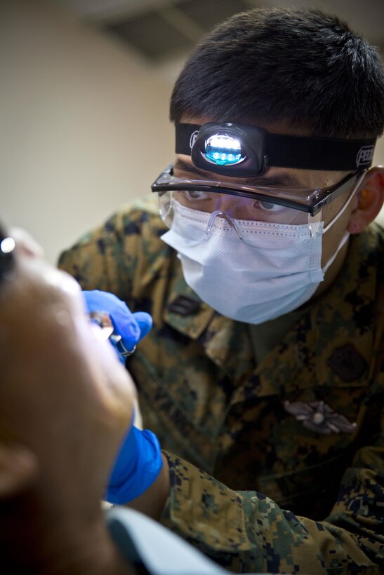 TINIAN MEDICAL CLINIC, Tinian (Sept. 23, 2016) – U.S. Navy Seaman Apprentice Joshua Vang injects Novacaine into the gums of Gener Abaga, a resident of Tinian, during Valiant Shield 2016. As a community outreach for Tinian, U.S. Navy medical personnel opened up a dental clinic at the Tinian Medical Clinic to provide oral care for the residents on Tinian. 
(U.S. Marine Corps photo by Cpl. Jacob Snouffer/Released)