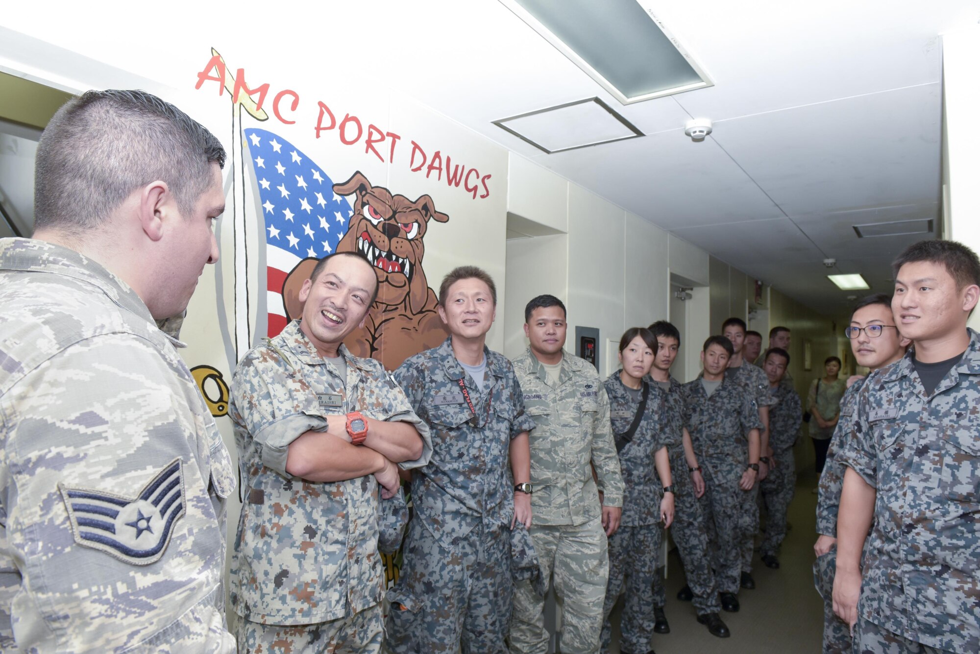 Japan Air Self-Defense Force members listen to a brief during the Bilateral Exchange Program at Yokota Air Base, Japan, Sept. 26. 2016. The program is designed to strengthen the US-Japan partnership and expand interoperability between the U.S. Air Force and JASDF through hands-on experience. (U.S. Air Force photo by Machiko Imai/Released)