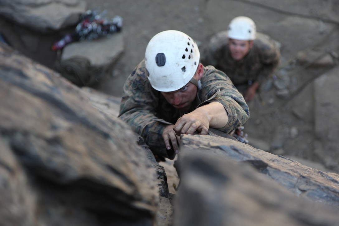 A Marine with 3rd Battalion, 8th Marine Regiments, climbs a rock face while attending Assault Climbers Course 3-16 at the Marine Corps Mountain Warfare Training Center, Sept 8, 2016.  The Assault Climber Course trains service members who work in ground combat arms military occupational specialties in mountain warfare tactics, techniques and procedures to serve effectively as force multipliers to their units during combat operations in complex, compartmentalized, and mountainous terrain. 