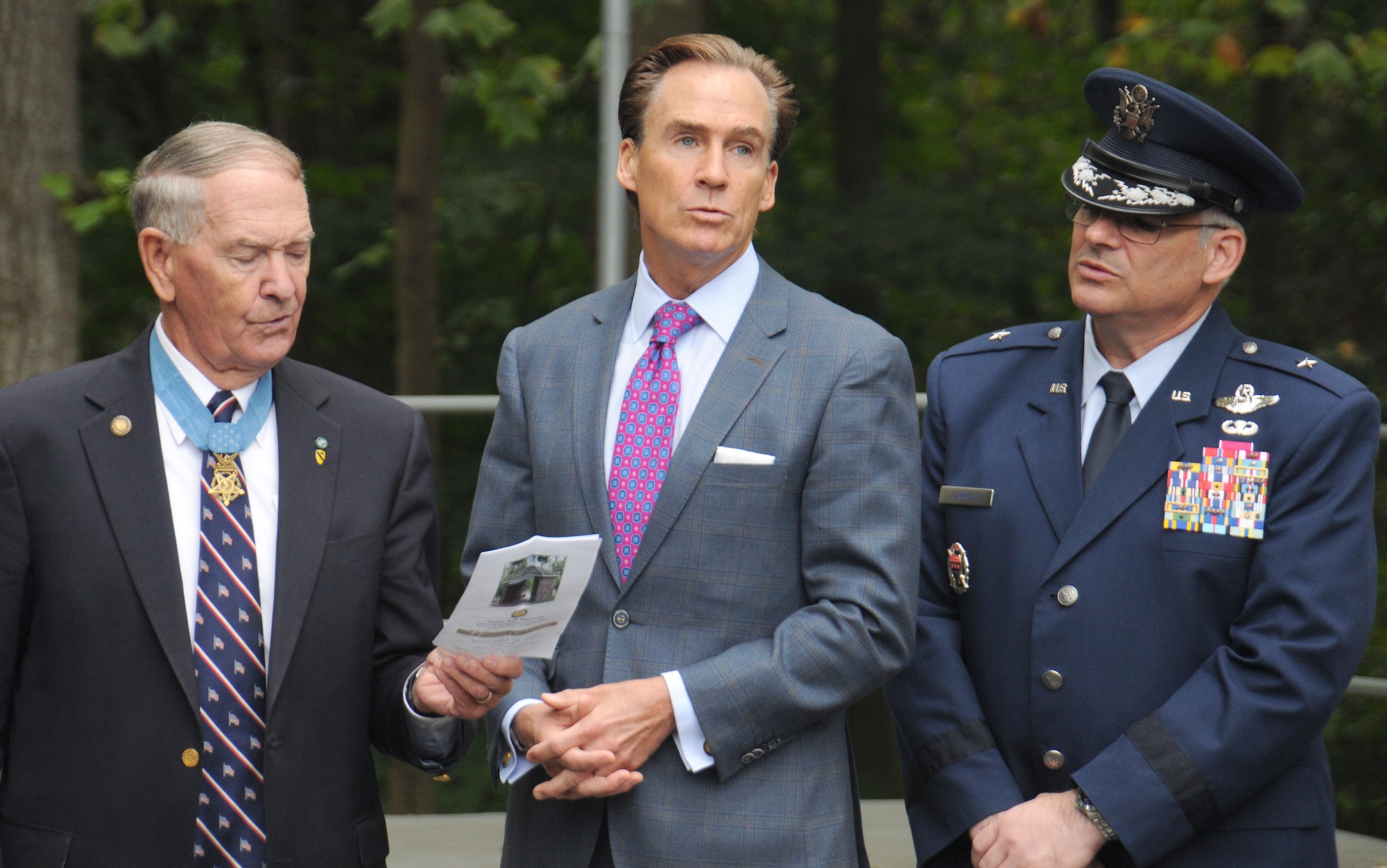 Retired Army Col. Walter Marm, Jr., the sole surviving native-Pennsylvanian Medal of Honor recipient (left), Pennsylvania Lt. Gov. Mike Stack and Pennsylvania Adjutant General Brig. Gen. Anthony Carrelli join in signing “America the Beautiful” during the closing of the Honoring our Heroes Ceremony held at the Freedoms Foundation’s, Medal of Honor Grove on Sep. 24, 2016 in Phoenixville, Pa. (U.S. Air National Guard photo by Master Sgt. Christopher Botzum)
