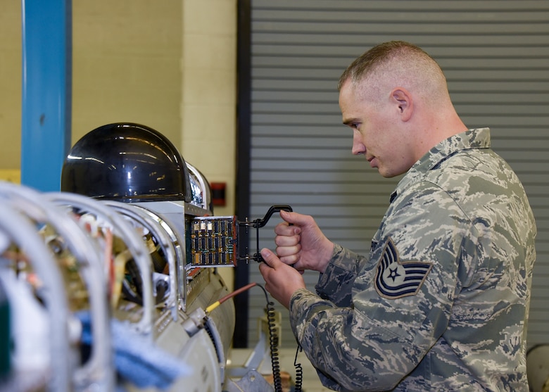 Tech. Sgt. Mollenhauer is replacing a printed wiring assembly on an electronic warfare pod Sept. 27, 2016 at Warfield Air National Guard Base, Middle River, Md. Mollenhauer is the Maryland Air National Guard October Spotlight Airman. (U.S. Air National Guard photo by Airman 1st Class Enjoli Saunders/RELEASED)