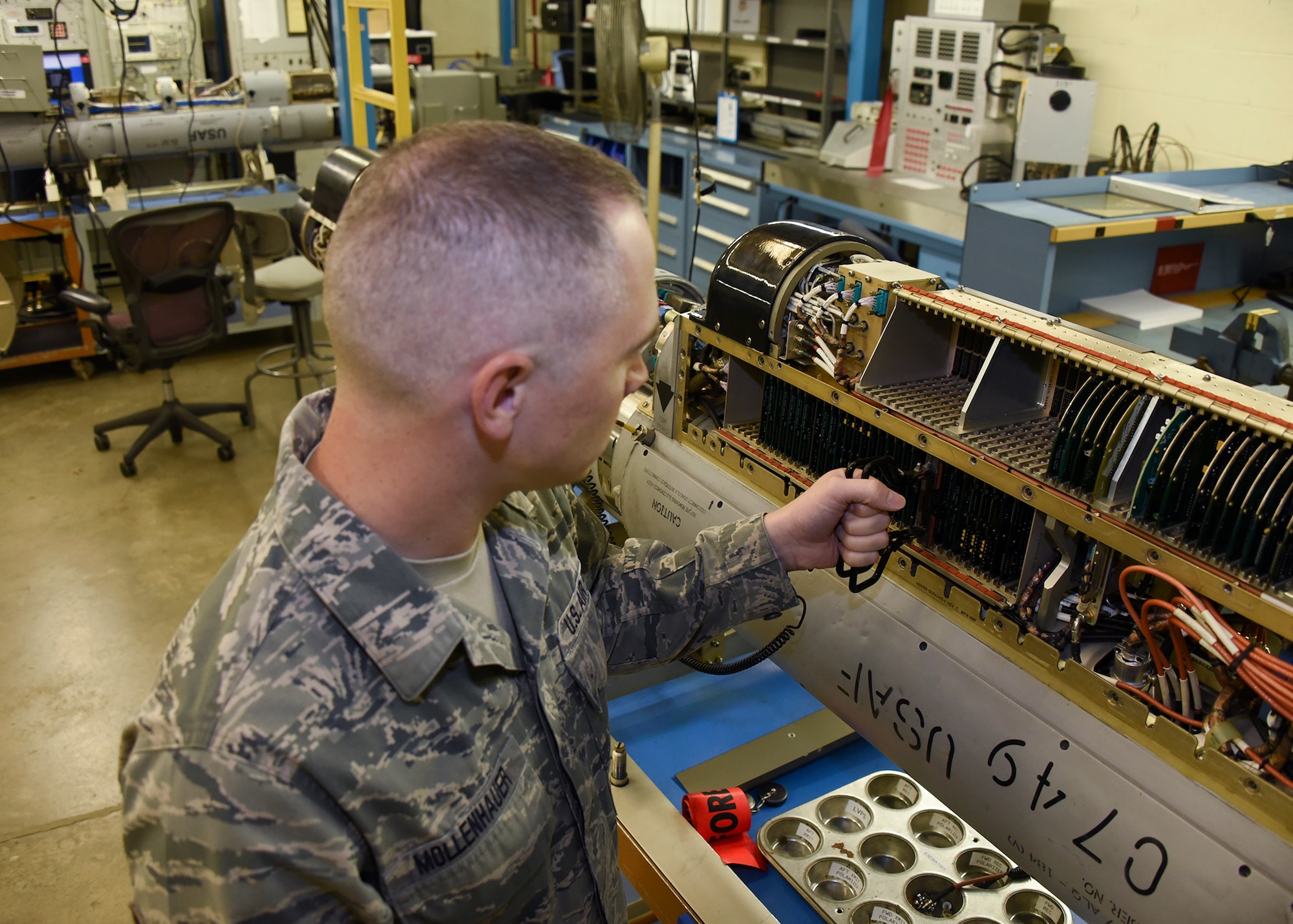 Tech. Sgt. Mollenhauer is replacing a printed wiring assembly on an electronic warfare pod Sept. 27, 2016 at Warfield Air National Guard Base, Middle River, Md. Mollenhauer is the Maryland Air National Guard October Spotlight Airman. (U.S. Air National Guard photo by Airman 1st Class Enjoli Saunders/RELEASED)