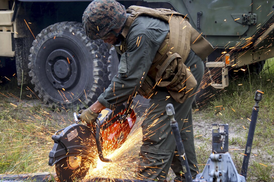 A Marine salvages an aircraft rotor during a field exercise at Camp Davis, N.C., Sept. 22, 2016. This exercise featured events such as auxiliary airfield construction, ground security and airfield damage repair. Marine Corps photo by Lance Cpl. Mackenzie Gibson

