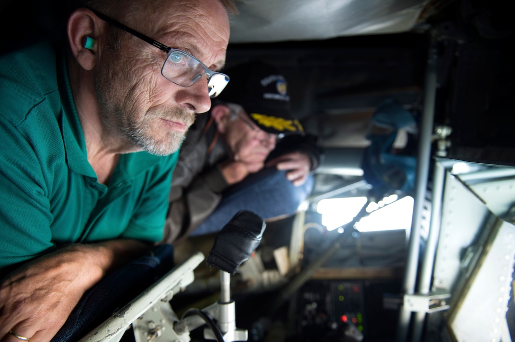 Ewald Heck, mayor of Landsheid, Germany, and Roger Feller, honorary commander of the 52nd Operations Group at Spangdahlem Air Base, Germany, stare out the boom window of a KC-135 Stratotanker from the 191st Air Refueling Squadron, Air National Guard Base, Utah, during a refueling mission over Ramstein Air Base, Sept. 26, 2016. The Stratotanker supplied 120,000 pounds of fuel to 13 of Spangdahlem’s F-16 Fighting Falcons during the course of two days. (U.S. Air Force photo/Airman 1st Class Preston Cherry)