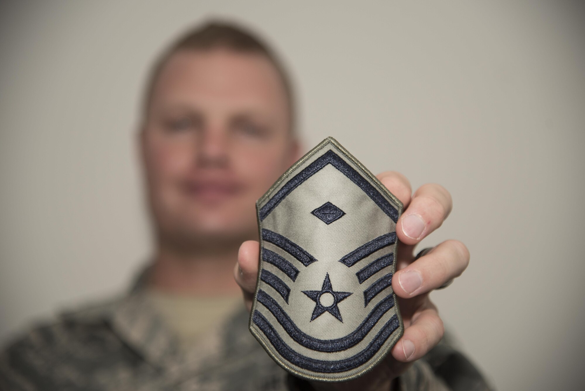 U.S. Air Force Master Sgt. Ryan Douglas, the 35th Communications Squadron first sergeant, displays a first sergeant rank insignia at Misawa Air Base, Japan, Sept. 26, 2016. First sergeants offer a four-day course called Additional Duty First Sergeant Symposium, for those interested in learning how the shirts operate and handle various situations. (U.S. Air Force photo by Airman 1st Class Sadie Colbert)