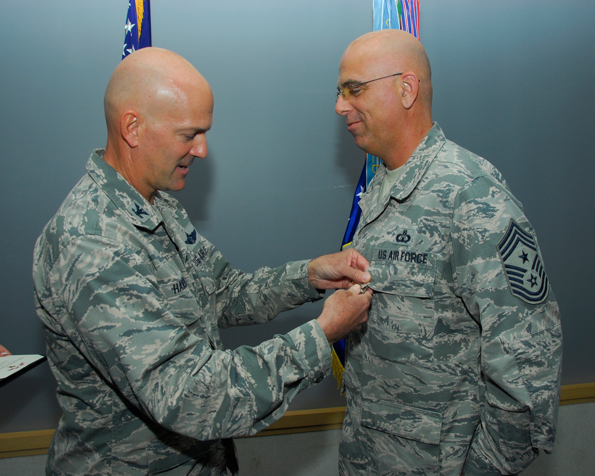 U.S. Air Force Col. Andrew Hansen, 51st Fighter Wing commander, pins a Bronze Star Medal to Chief Master Sgt. Alexander Del Valle, 51st FW command chief, Sept. 27, 2016, at Osan Air Base, Republic of Korea. Del Valle received the BSM for his accomplishments serving as the 438th Air Expeditionary Wing command chief at Forward Operating Base Oqab, Kabul, Afghanistan, from February 2015 to January 2016. (U.S. Air Force photo by Kyong Hwan Song)