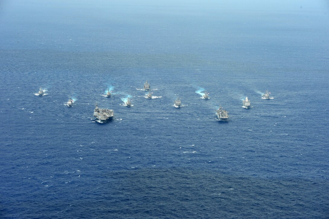 PHILIPPINE SEA (Sept. 23, 2016) USS Ronald Reagan (CVN 76) and USS Bonhomme Richard (LHD 6) lead a formation of Carrier Strike Group Five and Expeditionary Strike Group Seven ships including, USS Momsen (DDG 92), USS Chancellorsville (CG 62), USS Stethem (DDG 63), USS Benfold (DDG 65), USS Curtis Wilbur (DDG 54), USS Germantown (LSD 42), USS Barry (DDG 52), USS Green Bay (LPD 20), USS McCampbell (DDG 85), as well as USNS Walter S. Diehl (T-AO 193) during a photo exercise to signify the completion of Valiant Shield 2016. Valiant Shield is a biennial, U.S. only, field-training exercise with a focus on integration of joint training among U.S. forces. This is the sixth exercise in the Valiant Shield series that began in 2006.  (U.S. Navy photo by Chief Mass Communication Specialist Jay Pugh/Released)