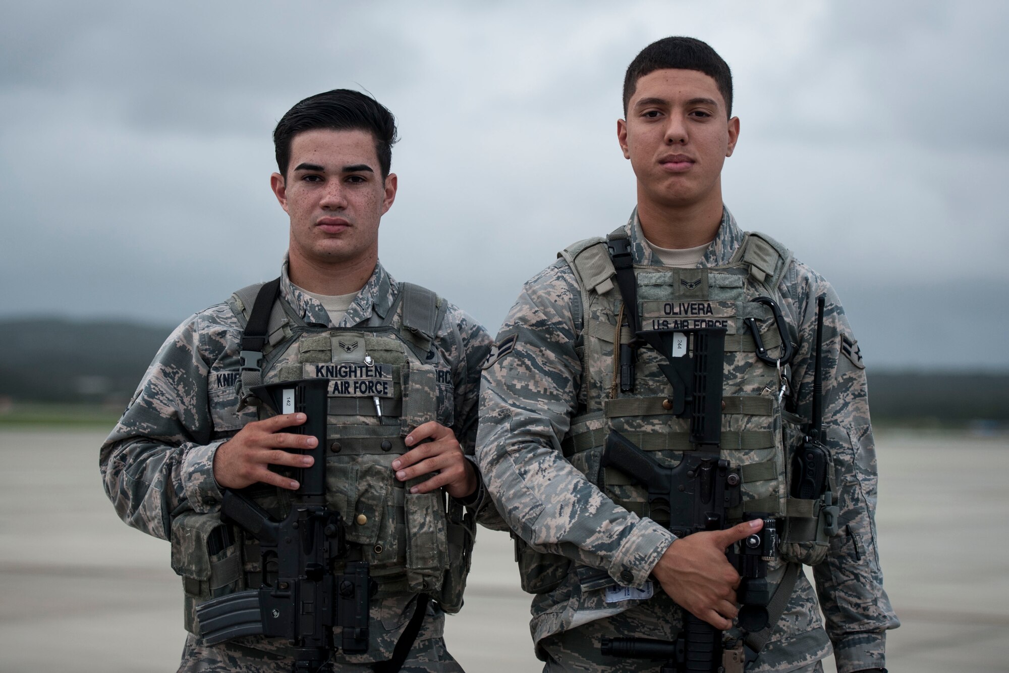 U.S. Air Force Airmen 1st Class Matthew Knighten and Jose Olivera, 18th Security Forces Squadron response force members, stand guard on the flightline Sept. 27, 2016, at Kadena Air Base, Japan. Knighten and Olivera provide constant watch and security over aircraft and other assets on the flightline, ensuring aircraft operations remain unhindered by unauthorized activity or personnel.  (U.S. Air Force photo by Senior Airman Peter Reft)