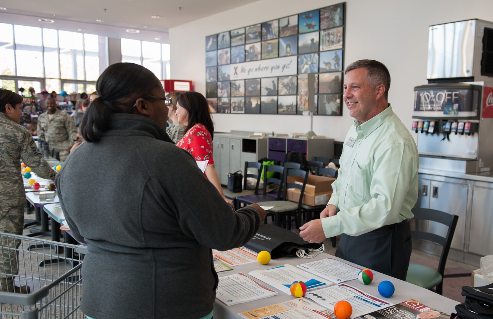 Wesley Yancey, the 86th Force Suppport Squadron Airman and Family Readiness Center’s Exceptional Family Member program manager, speaks to Jessica Walley, a Kaiserslautern Military Community member, at a suicide prevention fair Sept. 22, 2016, at Ramstein Air Base, Germany. The A&FRC offers thirteen core programs to assist members of the community and their quality of life here, as well as help with balancing family and work.

